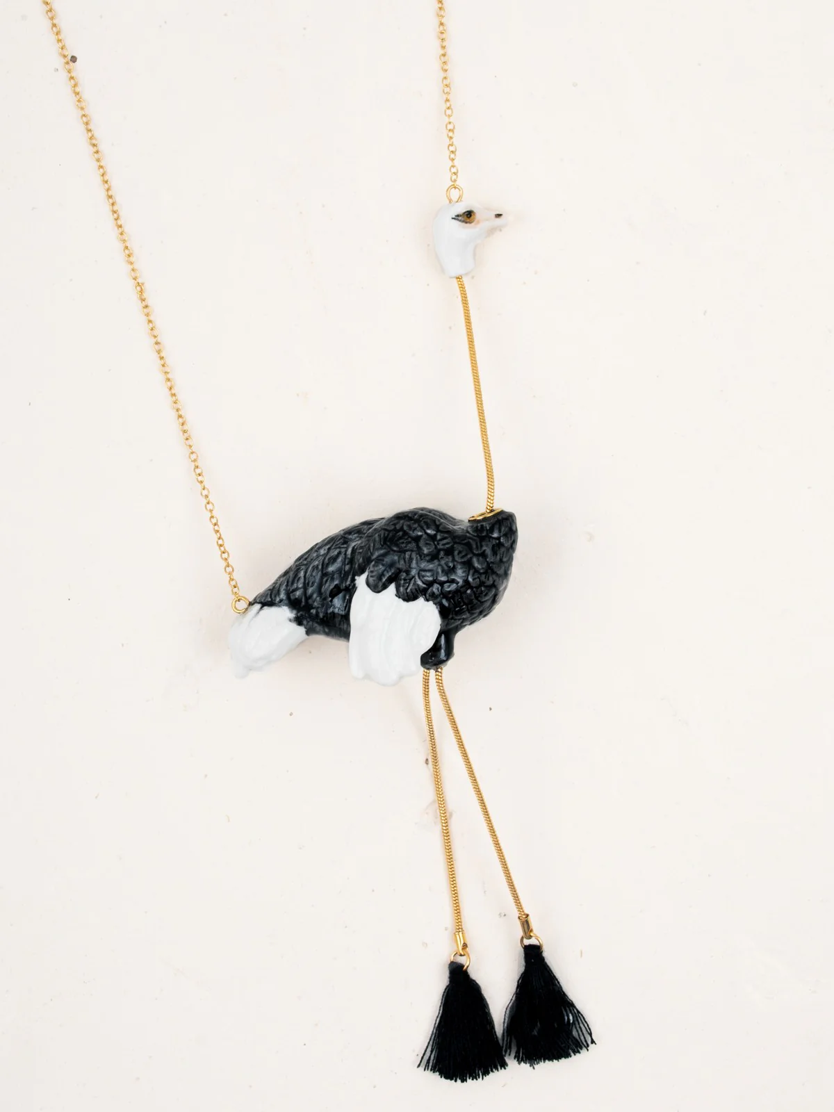 Collier autruche avec pompons