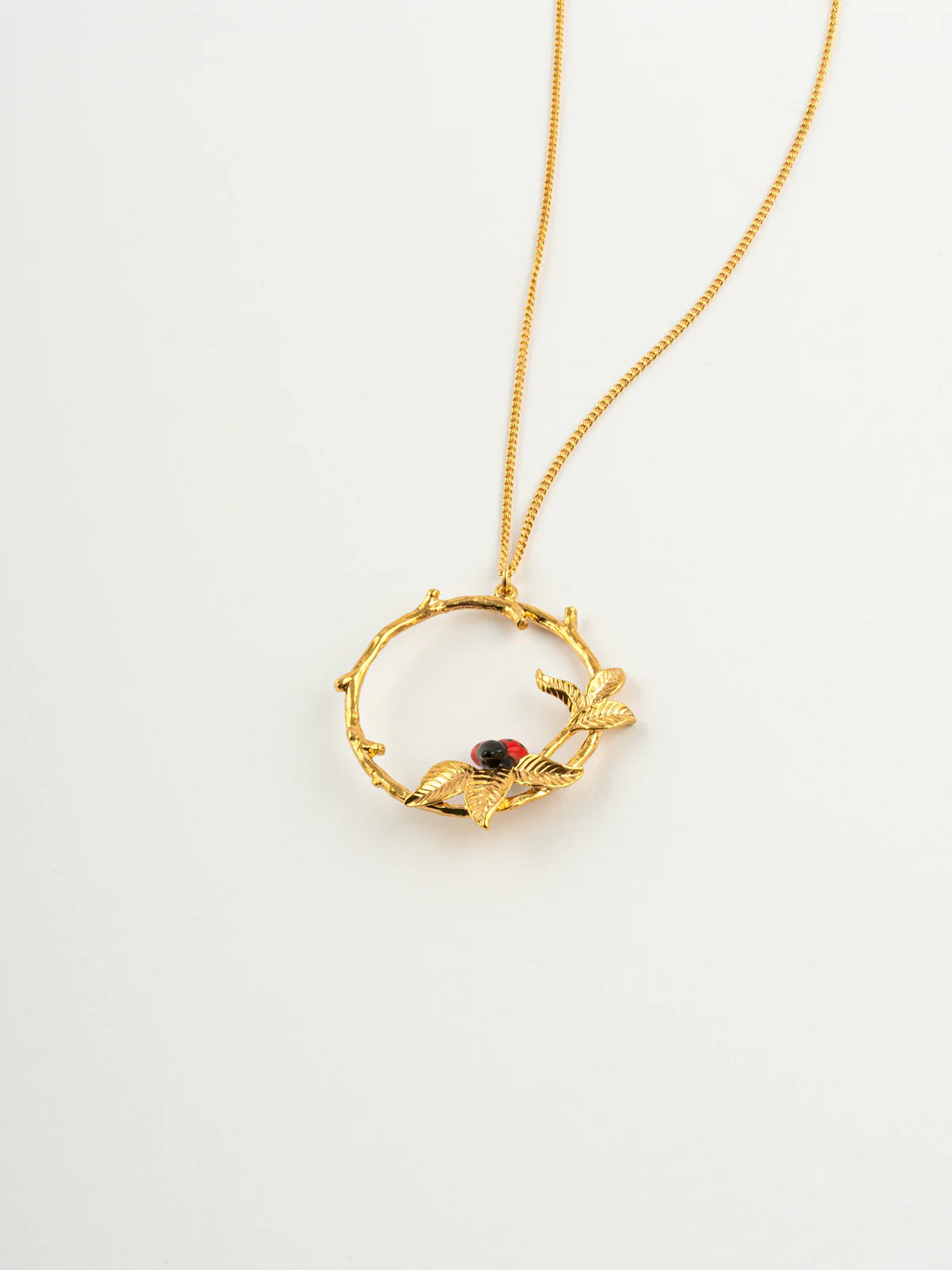 Collier coccinelle sur branche ronde