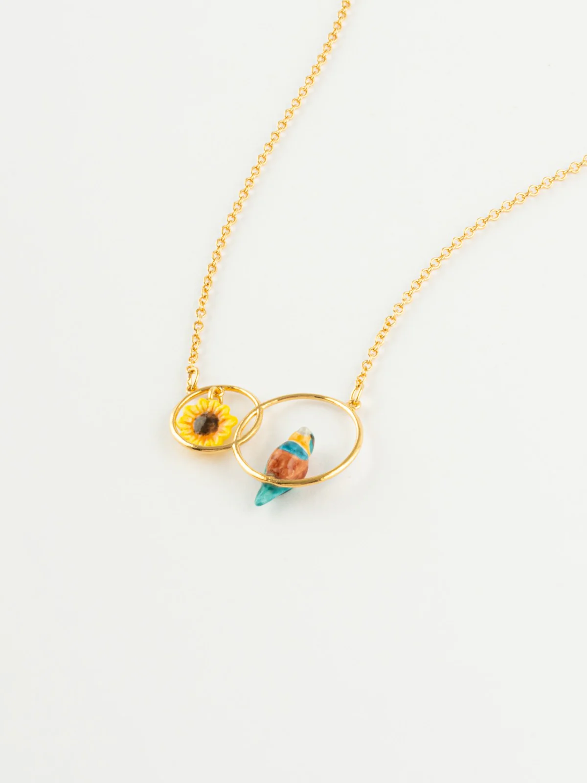 Collier anneaux guêpier et fleur