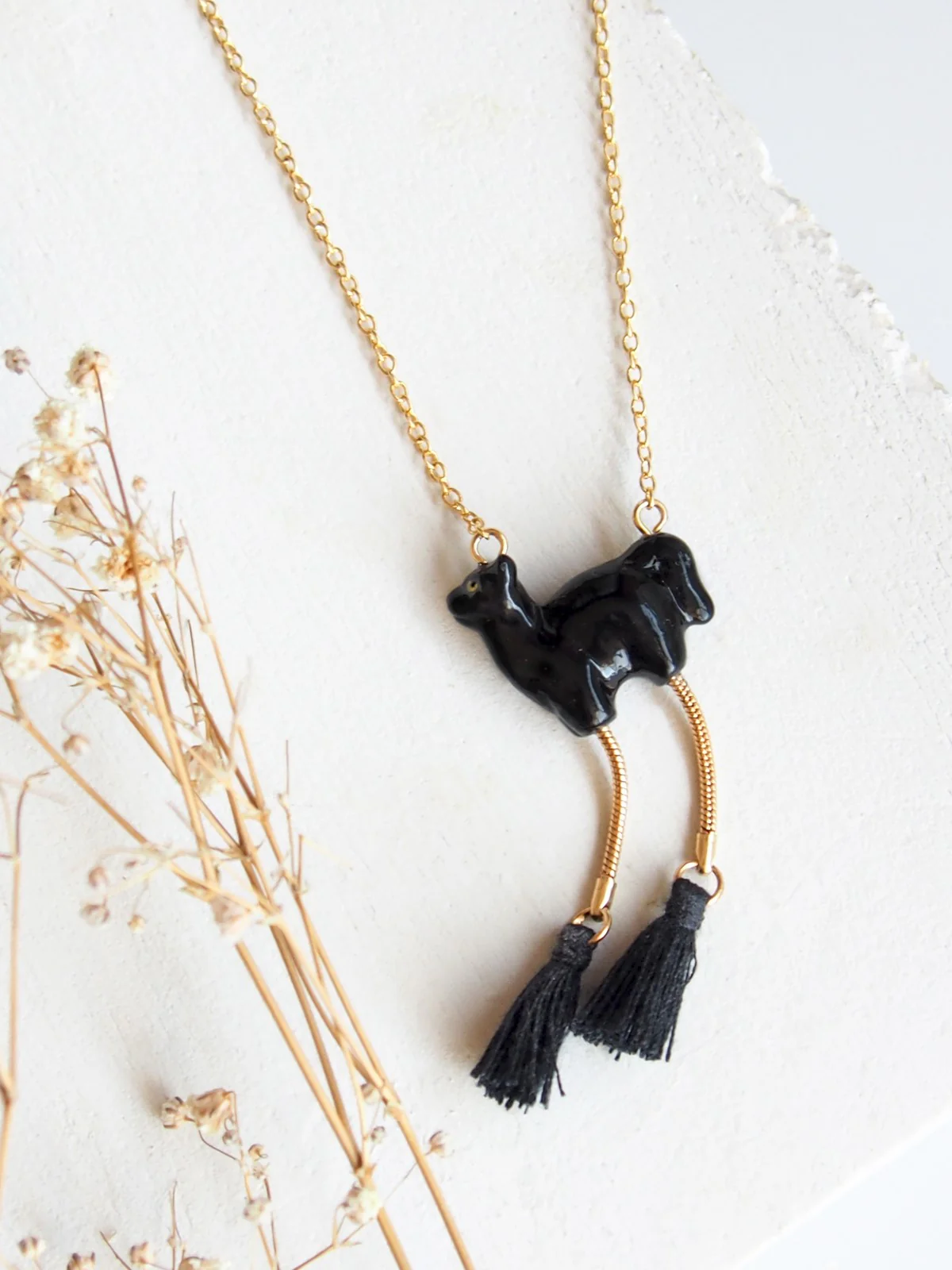 Collier chat noir avec pompons