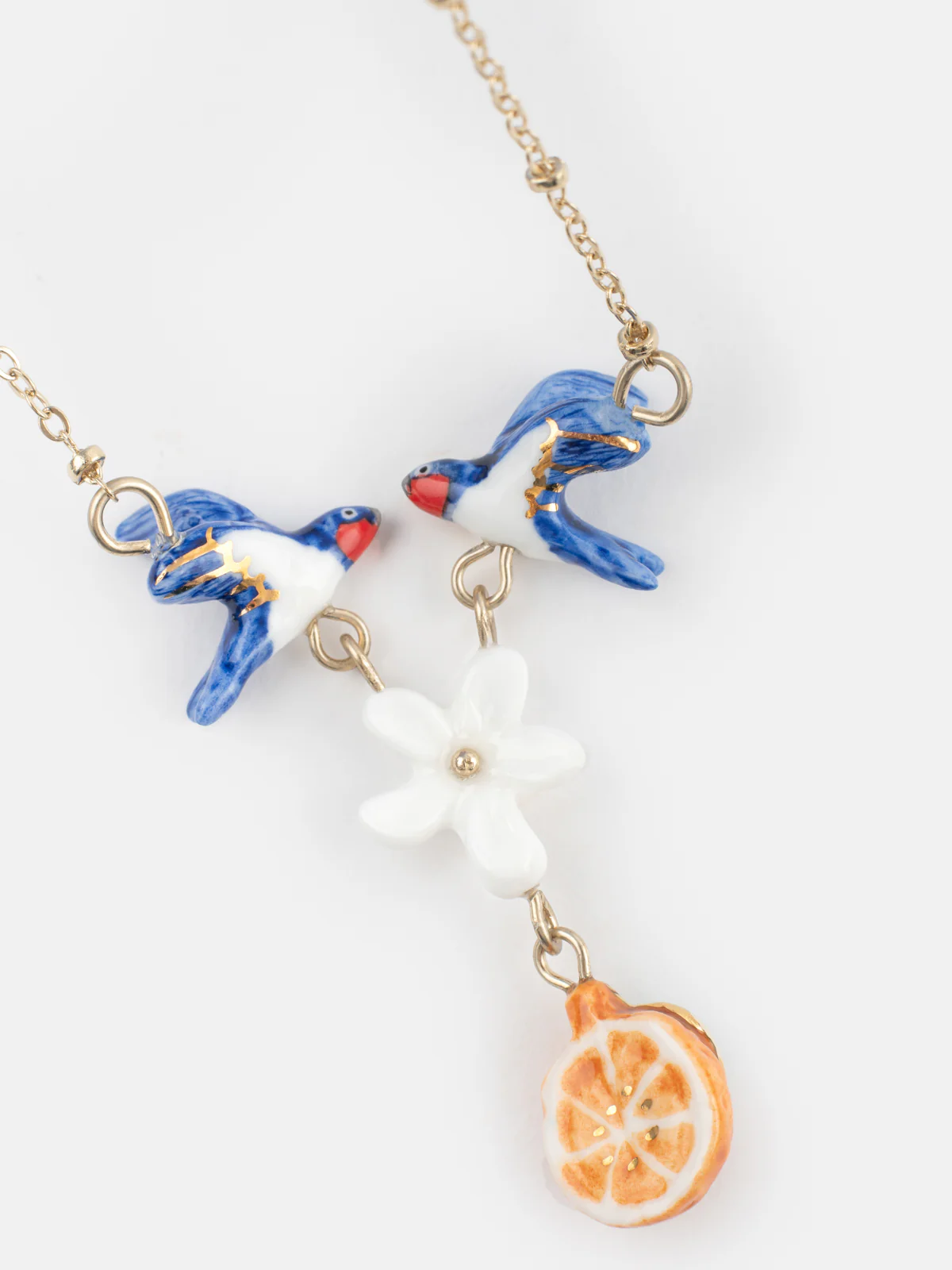 Collier couple d’hirondelles, fleur et orange - Image 4
