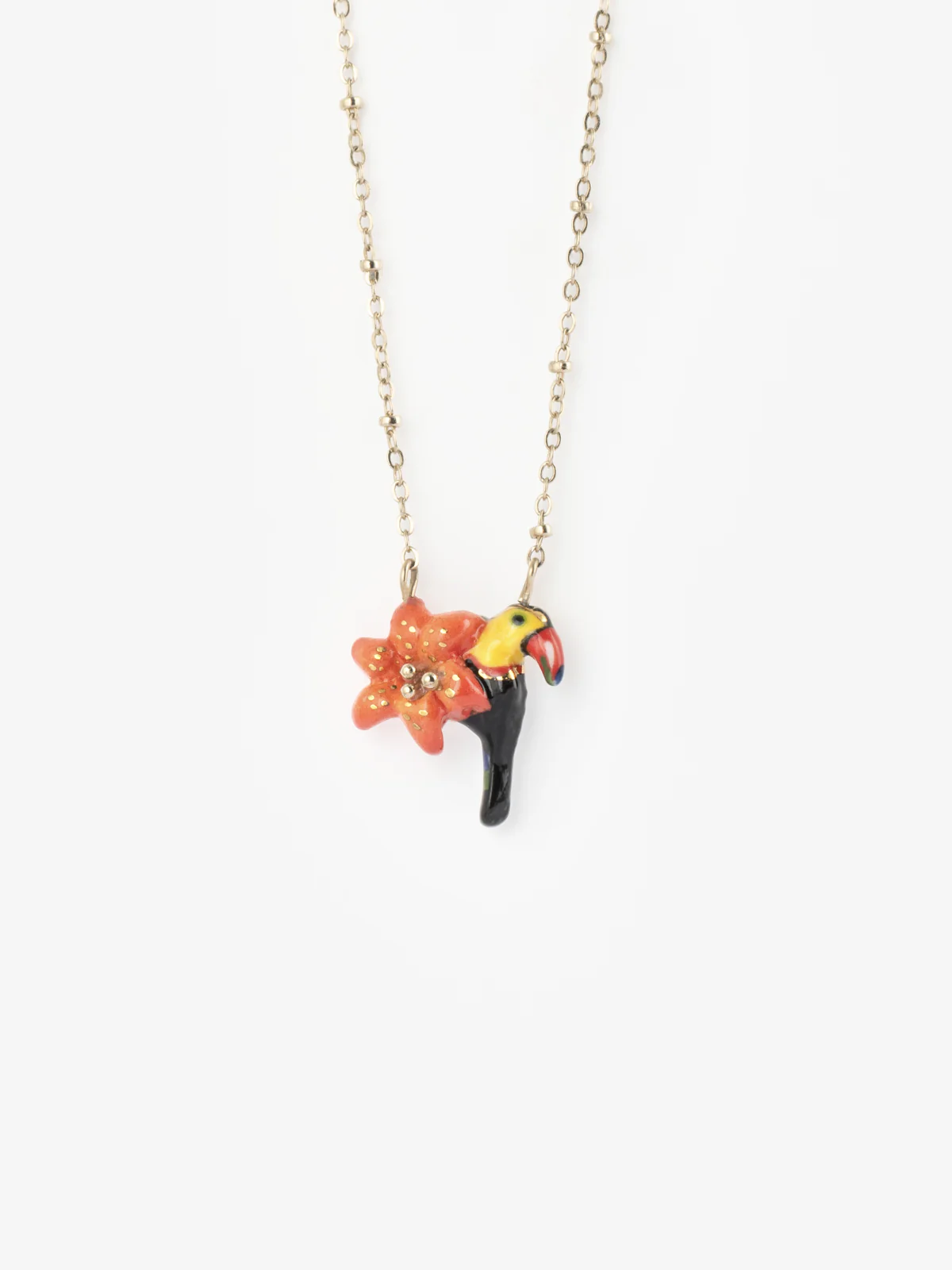 Collier lys et toucan